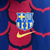 Jaqueta corta vento dupla face do Barcelona, nas cores azul e vermelho, com logo da Nike e do clube.