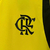 Regata amarela de treino do Flamengo para torcedores masculinos, da marca Adidas, com logotipo do clube e detalhes em preto.