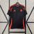 Camisa de torcedor masculina Adidas na cor preta com detalhes laranja, representando a seleção da Colômbia para a temporada 2024/25.