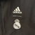 Agasalho corta vento da Adidas, modelo Real Madrid, cor preta, com detalhes em dragão e logo do clube.