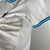 Camisa branca do Olympique de Marseille para torcedores masculinos, com detalhes em azul e logo da Puma.