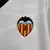 Camisa branca do Valencia CF, modelo 2023/2024, com logo da Puma e patrocinadores na frente.