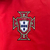 Agasalho corta vento da seleção de Portugal, dupla face vermelho, azul e branco, marca Nike, temporada 2024/25.