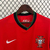 Camisa vermelha da seleção de Portugal, modelo 2024/25, fabricada pela Nike, com logo da marca e emblema da seleção.