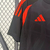 Camisa de torcedor masculina Adidas na cor preta com detalhes laranja, representando a seleção da Colômbia para a temporada 2024/25.