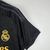 Camisa preta do Real Madrid III 2023/2024 para torcedores masculinos, com detalhes em dourado.