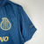 Camisa torcedor masculina do FC Porto III 2023/2024, na cor azul, com detalhes em dourado e logo da New Balance.