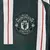 Camisa verde do Manchester United II 2023/2024, modelo torcedor masculino da Adidas, com listras verticais e logo da equipe.