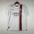 Camisa branca do AC Milan II 2023/2024 para torcedores masculinos da Puma, com detalhes em preto e vermelho.