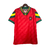 Camisa retrô masculina da seleção de Portugal, modelo 1992/94, na cor vermelha, com detalhes em verde e amarelo e logo da Adidas.