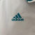 Jaqueta corta vento dupla face da Real Madrid, modelo 2024/25 da Adidas, nas cores azul e branca.