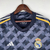 Camisa do Real Madrid II 2023/2024 para torcedores masculinos, na cor preta, com detalhes em amarelo e logo da Adidas.