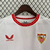 Camisa branca do Sevilla FC, modelo torcedor masculina da temporada 2024/25, com detalhes em vermelho e logotipo da Castore.