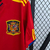 Camisa retrô vermelha da seleção da Espanha, modelo masculino, fabricada pela Adidas, com detalhes em amarelo e escudo da equipe.