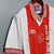 Camisa retrô masculina do Ajax de 1995/1996, branca com detalhes em vermelho e gola listrada, da umbro.