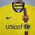 Camisa retrô amarela do Barcelona, temporada 2008/2009, com logo da Nike e detalhes em vermelho e azul.