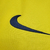 Camisa retrô amarela do Barcelona, temporada 2008/2009, com logo da Nike e detalhes em vermelho e azul.