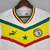 Camisa branca do Senegal, modelo 2022/2023, com detalhes em verde, amarelo e vermelho, da marca Puma, Titular.