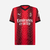 Camisa masculina vermelha do AC Milan 2023/2024, modelo torcedor da Puma, com logo e estampa em destaque.