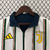 Agasalho corta vento da Juventus, modelo dupla face, nas cores branca e azul, com listras verticais e logotipo da Adidas.