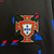 Camisa preta de treino da seleção de Portugal 2024/25, com estampas coloridas e logo da Nike.