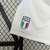 Calção branco masculino da seleção italiana de futebol, da marca Adidas, com detalhes em azul e logo da Itália.