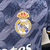 Camisa masculina do Real Madrid II 2023/2024, fabricada pela Adidas, na cor azul, com logo do clube e patrocinador.