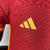 Camisa masculina vermelha da Roma I 2023/2024, da Adidas, com detalhes em amarelo e logotipo do time.