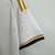 Camisa branca do Real Madrid I 2023/2024 para torcedores masculinos da Adidas, com detalhes em dourado e logo da equipe.