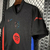 Camisa preta do Barcelona II 2024/25 para torcedores masculinos, da Nike, com detalhes em vermelho e azul.