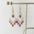 Aretes candelabro con granate