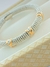 PULSEIRA BRACELETE BOLINHAS PRATA COM DETALHE DOURADO FOLHADO A OURO - comprar online