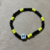 Pulseira Signo Peixes Preto/Amarelo