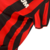 Camisa retrô do AC Milan 1990/1991, masculina, nas cores vermelha e preta, com detalhes em preto e logotipo da Adidas.

