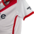 Camisa branca do River Plate com detalhes em vermelho e logotipo do time, modelo 23/24 para torcedores.

