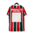 Camisa retrô do Fluminense, modelo de 1993, nas cores vermelha e verde com listras verticais e logotipo da Penalty.