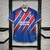 Camisa do Bahia Away 24/25 Torcedor Masculina nas cores vermelho e azul, com detalhes em listras diagonais e logotipo do clube.