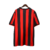 Camisa retrô do AC Milan 1990/1991, masculina, nas cores vermelha e preta, com detalhes em preto e logotipo da Adidas.

