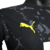 Camisa preta do Borussia Dortmund II 23/24, modelo masculino, com detalhes em amarelo e logo da Puma.

