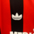 Camisa retrô do AC Milan 1990/1991, masculina, nas cores vermelha e preta, com detalhes em preto e logotipo da Adidas.

