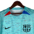 Camisa azul claro do Barcelona III 23/24, modelo torcedor da Nike, com logo do time e estampa em linhas verticais.

