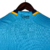 Camisa Cruzeiro III 23/24 Torcedor Masculina em azul claro, com detalhes em amarelo e logo do clube.

