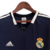 Camisa retrô do Real Madrid, modelo away 04/05 da Adidas, na cor azul escuro com detalhes em branco.

