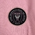 Camisa feminina rosa do Inter Miami, modelo torcedor, com detalhes em preto e logotipo da Adidas.

