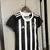 Camisa feminina do Atlético Mineiro, modelo 24/25, com listras verticais em preto e branco e logo do clube.