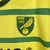 Camisa amarela do Norwich City FC com detalhes em verde, modelo para torcedores, da marca Joma, temporada 23/24.

