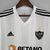 Camisa branca e preta do Atlético Mineiro II 22/23, modelo torcedor da Adidas, com detalhes em preto e logo do clube.

