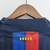 Camisa do Barcelona Home 22/23 da Nike, nas cores azul marinho, azul royal e vermelho, com logo da equipe e patrocinador Spotify.

