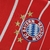 Camisa vermelha do Bayern de Munique, modelo Home 22/23, com listras brancas e logo da Adidas.

