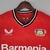 Camisa vermelha do Bayer Leverkusen I 22/23, com o logo da Castore e o nome "Barmenia" em destaque.

